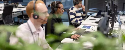 Colleagues working at desk 