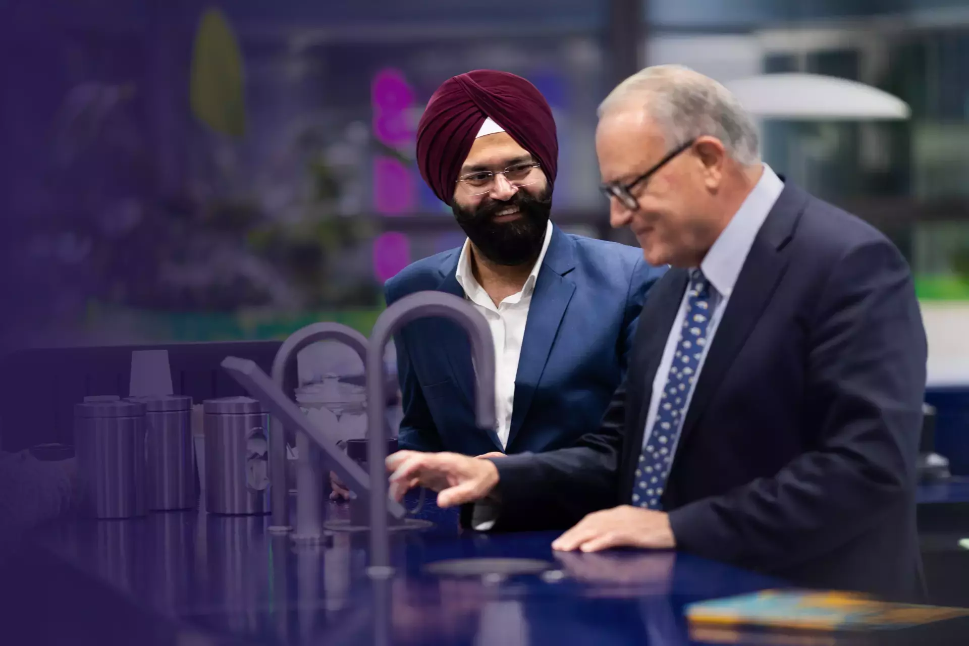 Two men talking in an office 