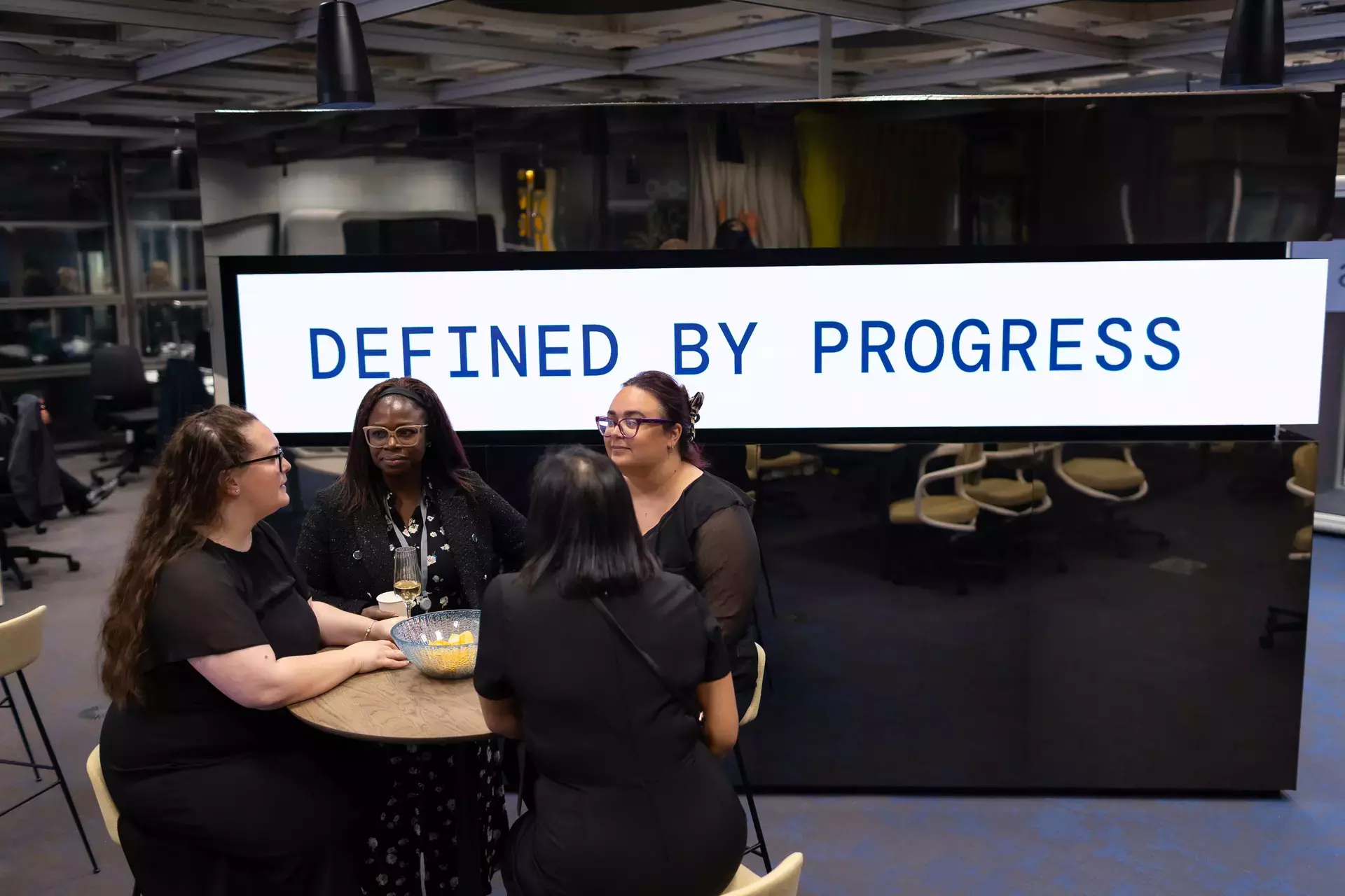 people_colleagues_sitting_and_talking_in_office