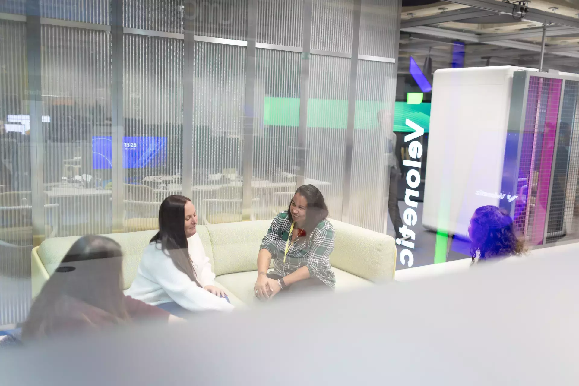 people_colleagues_talking_in_office_on_sofas.