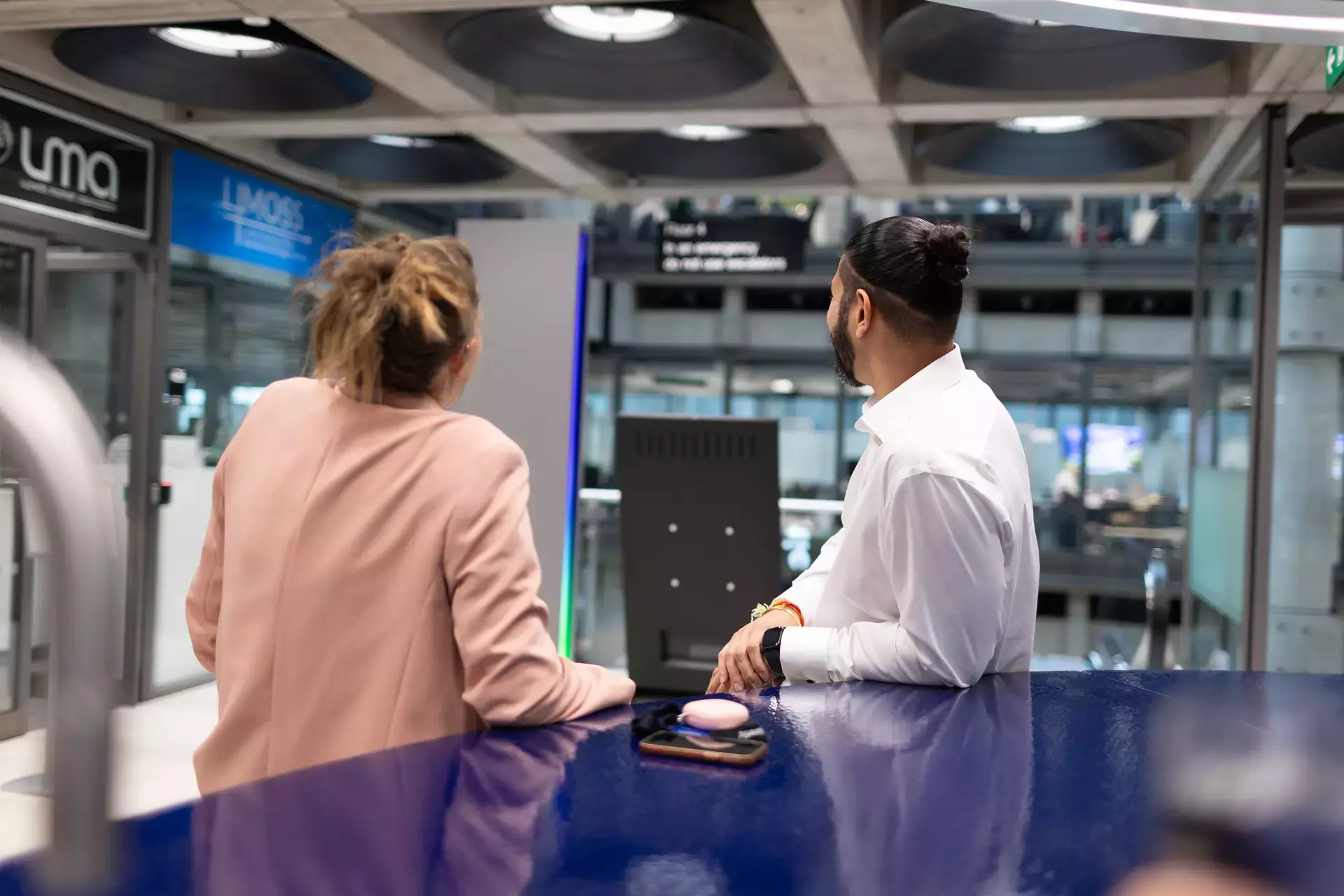 people_colleagues_talking_looking_out_into_lloyds_building_by_coffee_area