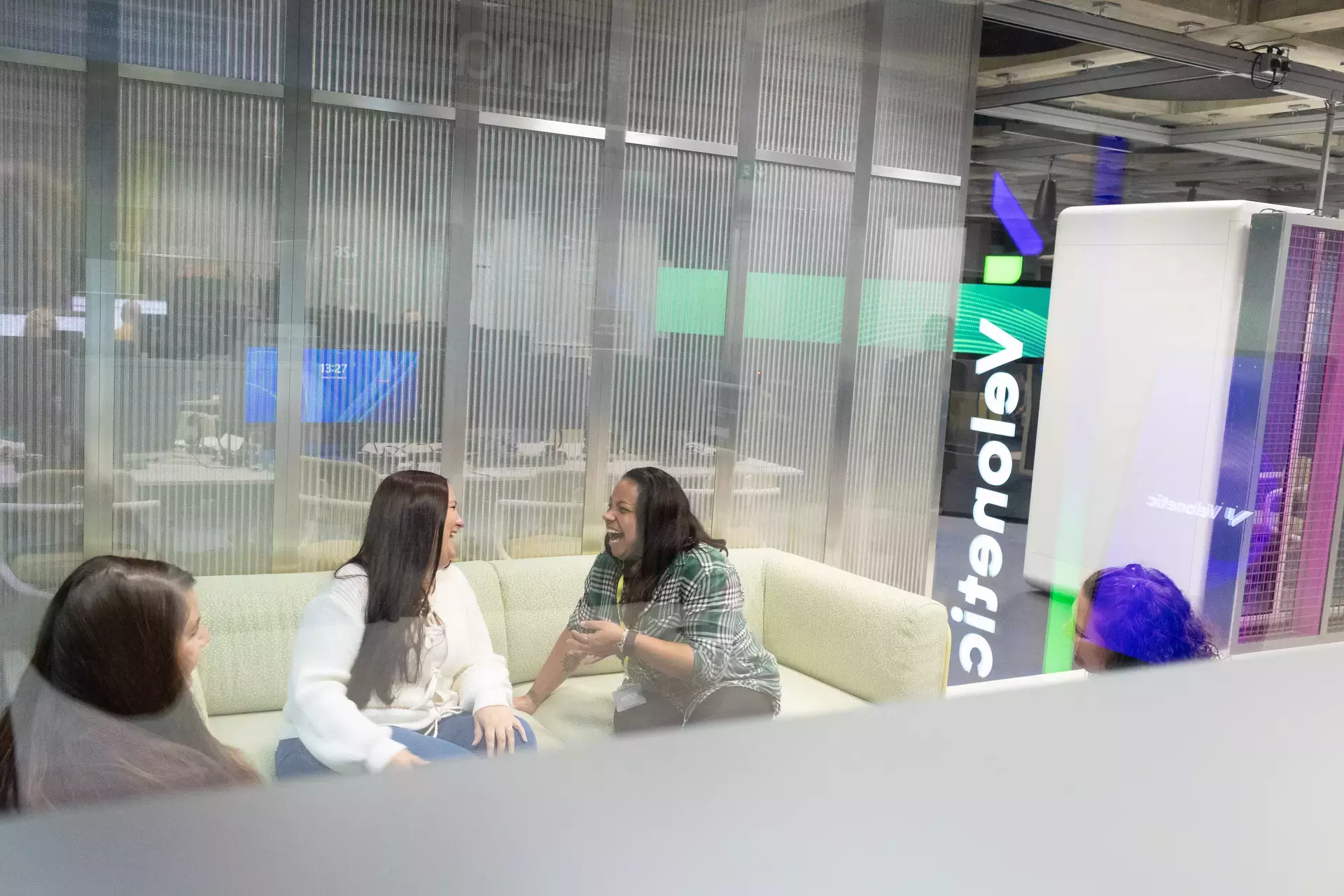 people_colleagues_talking_on_sofas_in_office.