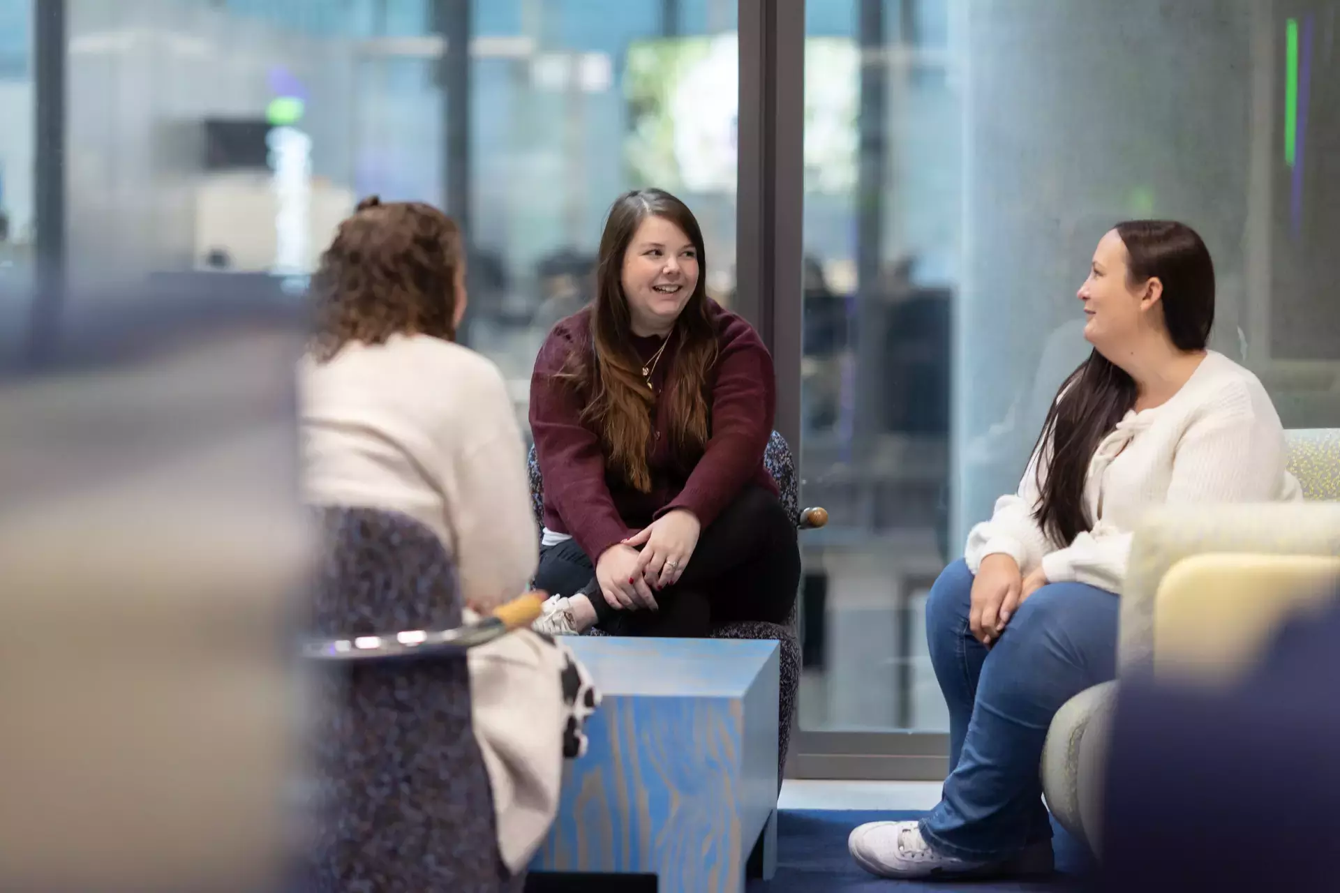 people_colleagues_talking_sitting_in_office