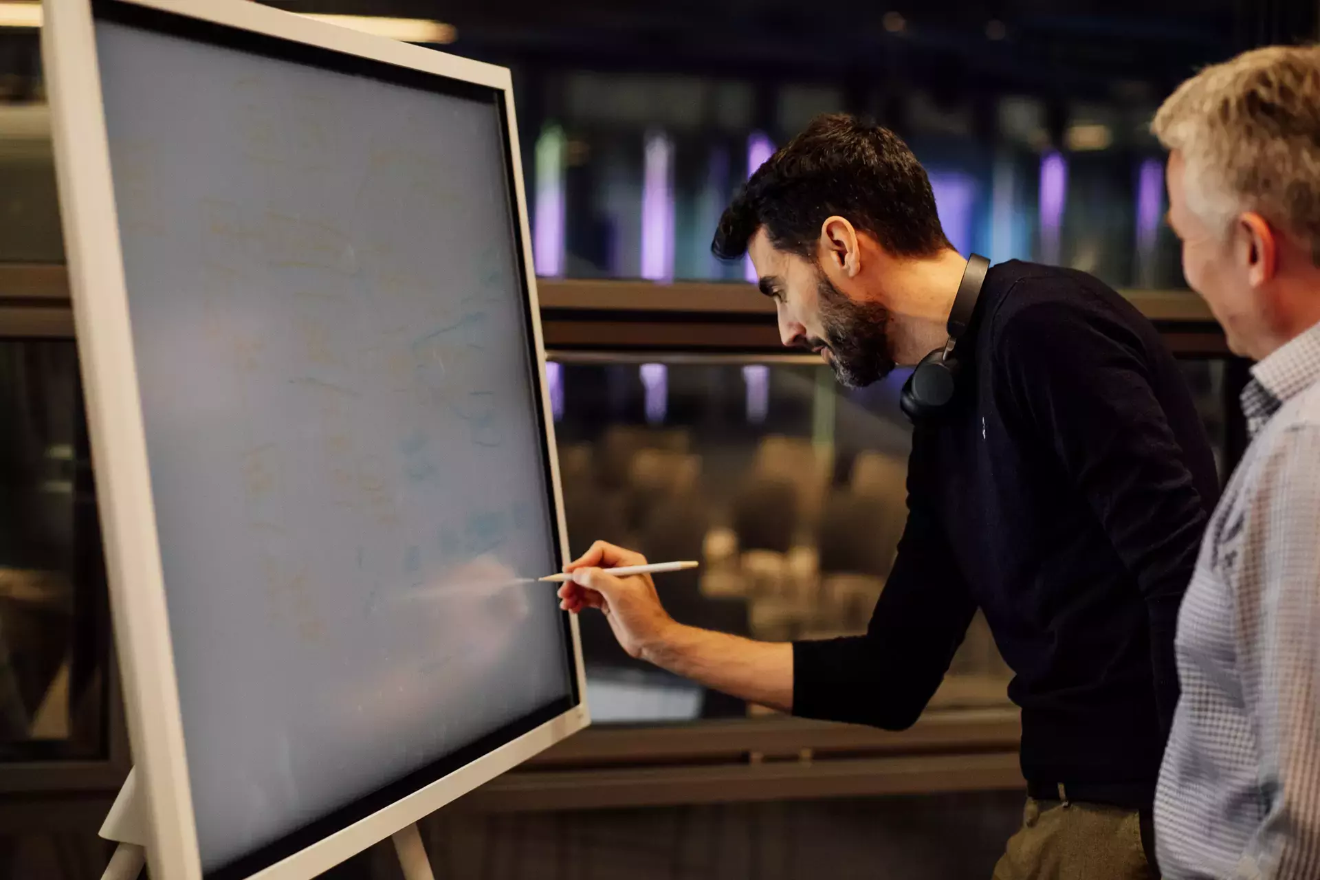 Man writing on a whiteboard